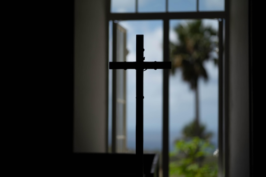 A cross framed in the window.