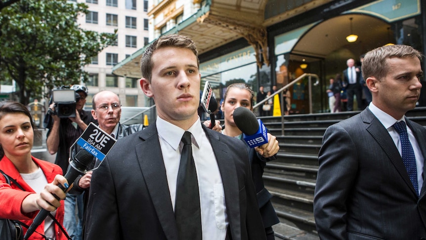 Alexander Gall leaves Sydney's Downing Centre Court surrounded by the media.