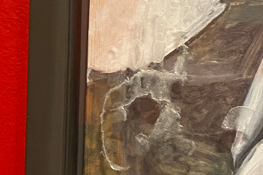 a hand print in glue on a painting.