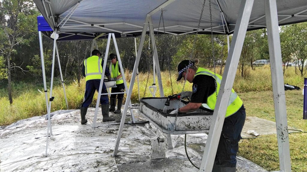 Police sift through dirt dug up at a site at Carole Park searching for the remains of Sharron Phillips