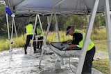 Police sift through dirt dug up at a site at Carole Park searching for the remains of Sharron Phillips