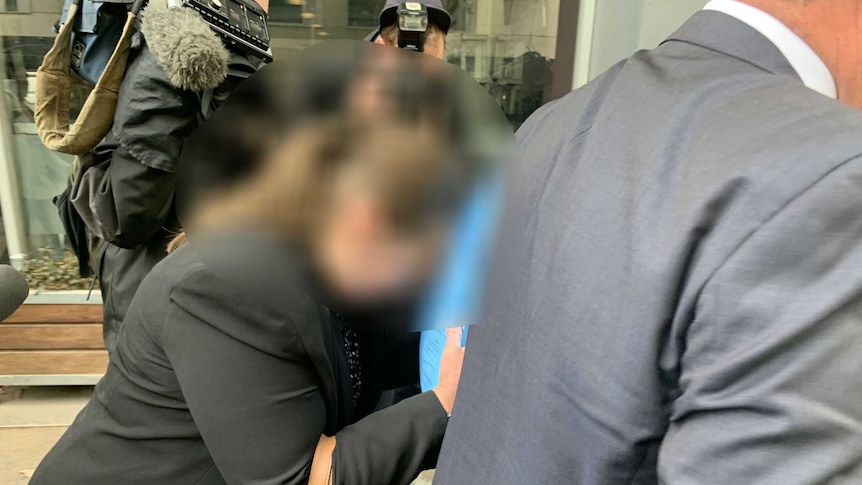 A woman with her face blurred appears at a court hearing in Melbourne.
