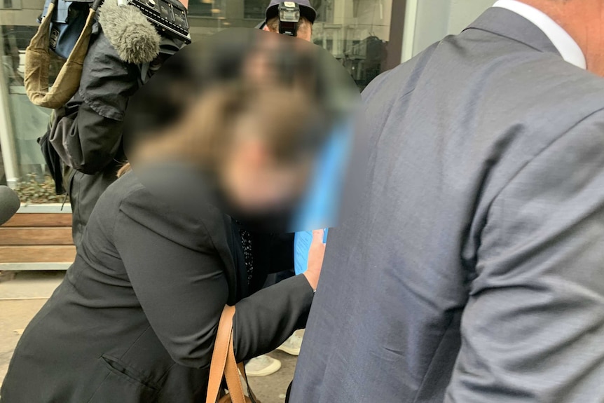 A woman with her face blurred appears at a court hearing in Melbourne.