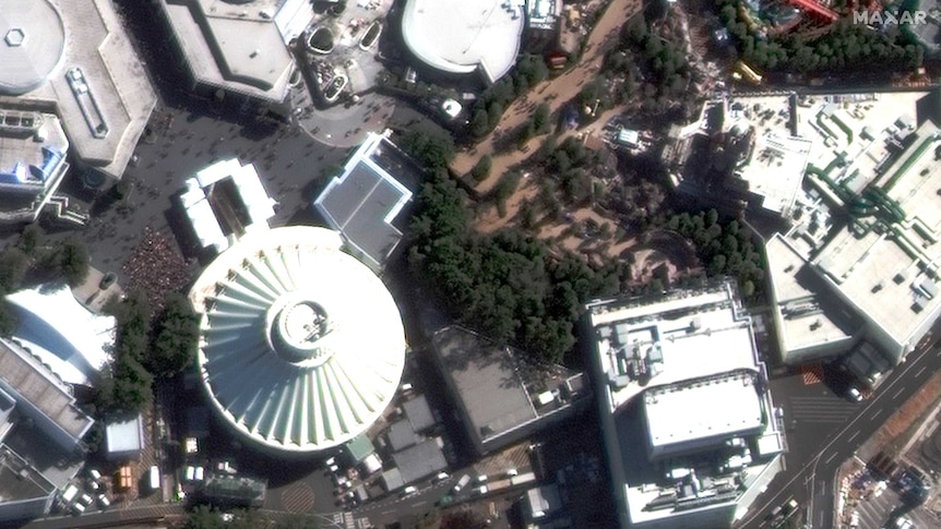 Satellite imagery shows a large crowd outside the Space Mountain ride at Tokyo Disneyland.