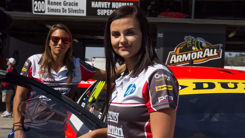 Renee Gracie and Simona De Silvestro stand beside the car they will use to compete in the Bathurst 1000.