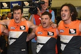 Emphatic performance ... The Giants sing the club song after their win over the Swans