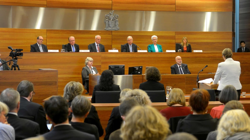 Royal Commission sits on the opening day.