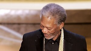 Actor Morgan Freeman holds Oscar after winning for best supporting actor