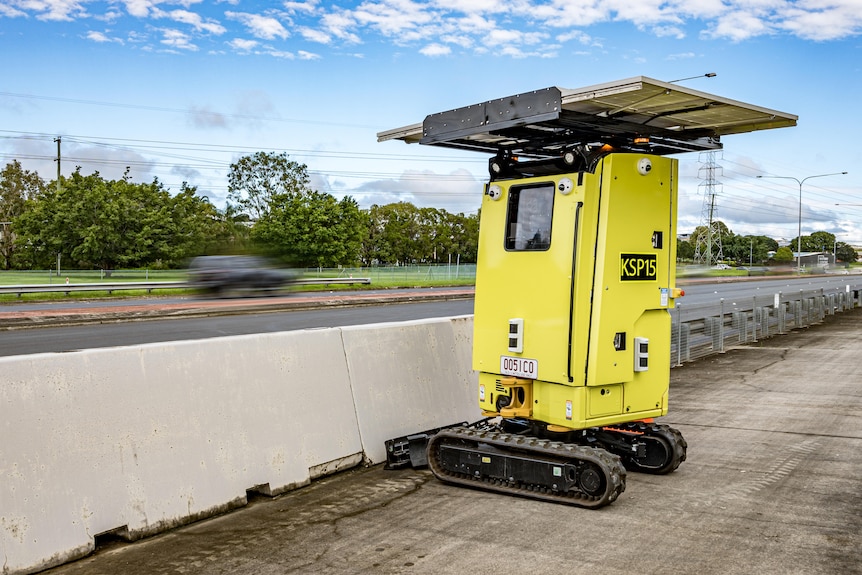 An image of a yellow solar powered sign at road works site 