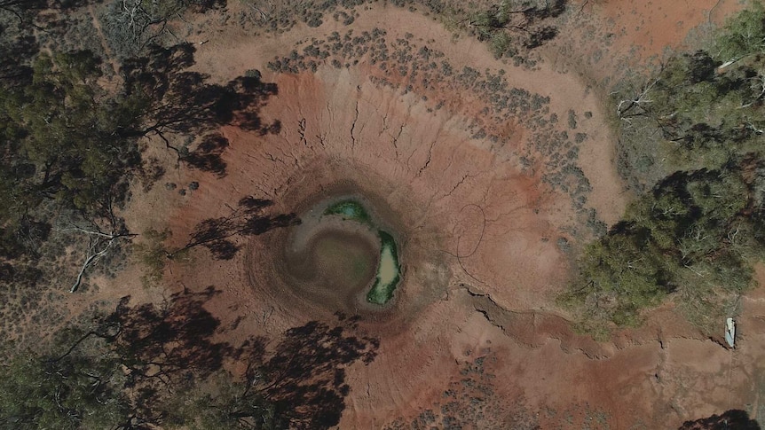 A dry dam on a farm in a drought-declared area of New South Wales