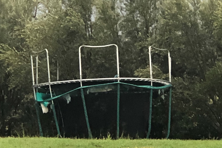 Upturned trampoline at a property during a storm at Munbilla, west of Ipswich