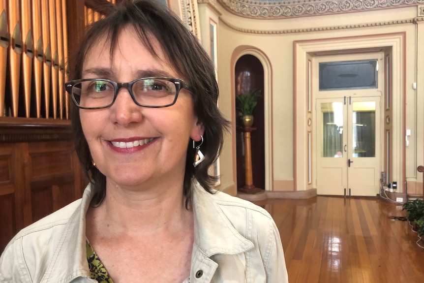 Helen Burnet smiles at the camera.