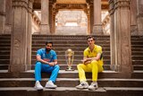 Pat Cummins and Rohit Sharma pose with the world cup