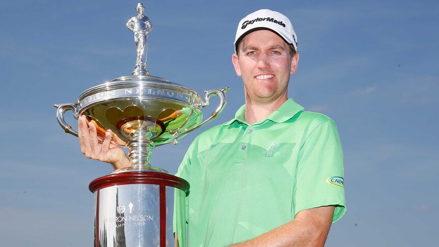 Brendon Todd poses with the trophy after winning the Byron Nelson Championship title.