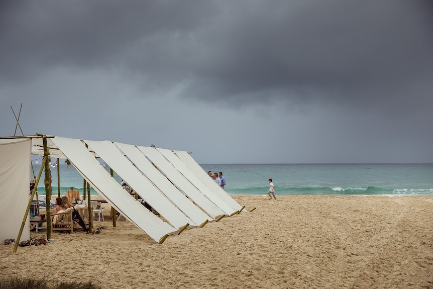 A storm rolls in on Home Beach on North Stradbroke Island during a 40th Birthday bash in a bamboo hut.