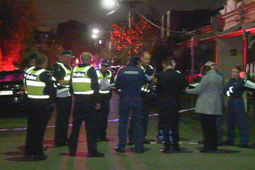 Police on the scene after a man is arrested following the discovery of a body in Fitzroy.