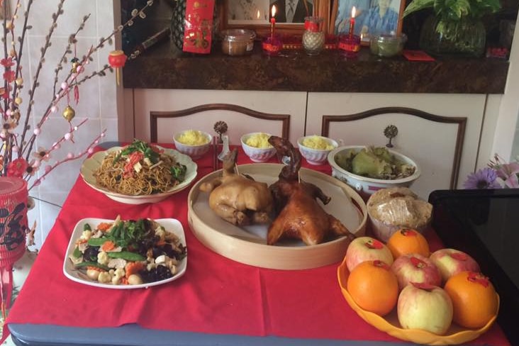 Dug and other dishes are served up on a table for Lunar New Year.
