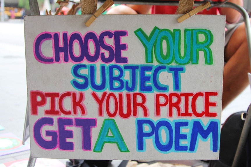 A colourful, hand-painted sign reading choose a subject, pick a price, get a poem.
