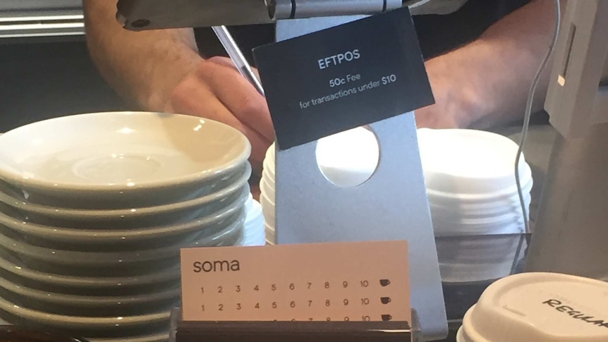 Notice in Sydney cafe advertising 50 cent EFTPOS surcharge for transactions under $10