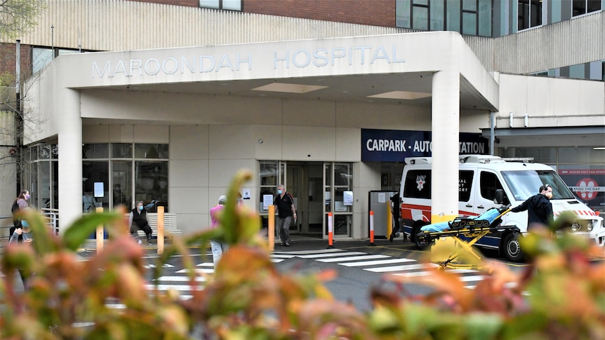 the outside of Maroondah hospital. There is an ambulance parked out front.