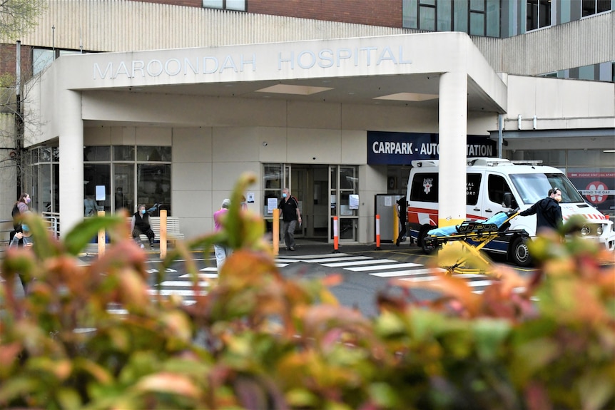 the outside of Maroondah hospital. There is an ambulance parked out front.