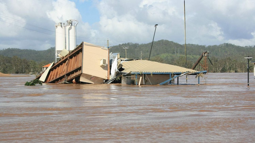 Damaged building at the flooded Zanow family’s quarry business in Fernvale, west of Brisbane, during the 2011 floods.