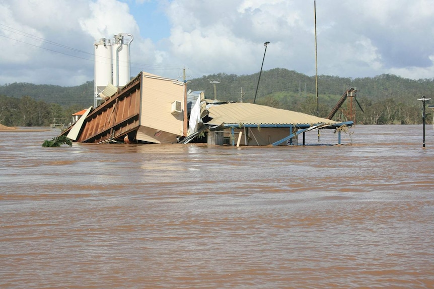 Damaged building at the flooded Zanow family’s quarry business in Fernvale, west of Brisbane, during the 2011 floods.