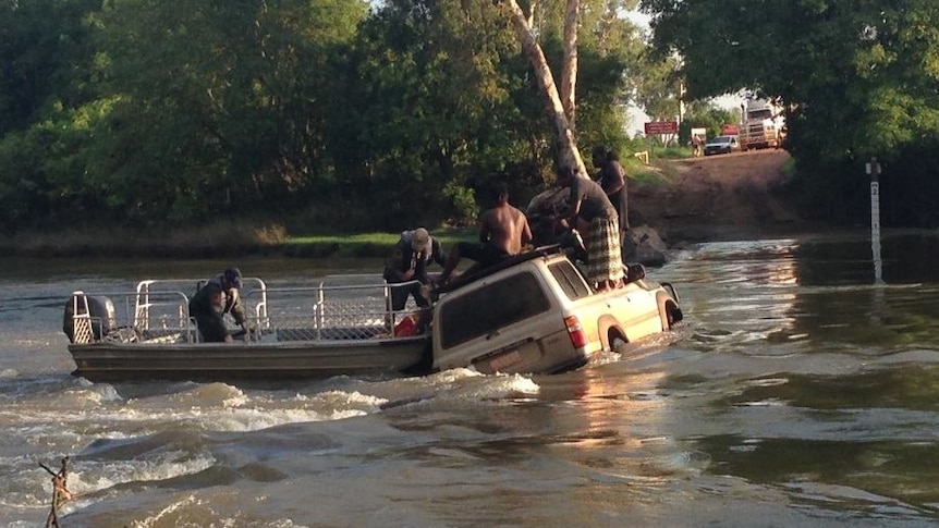 A Toyota Landcruiser gets stranded after being washed off the road at Cahill's Crossing in Kakadu