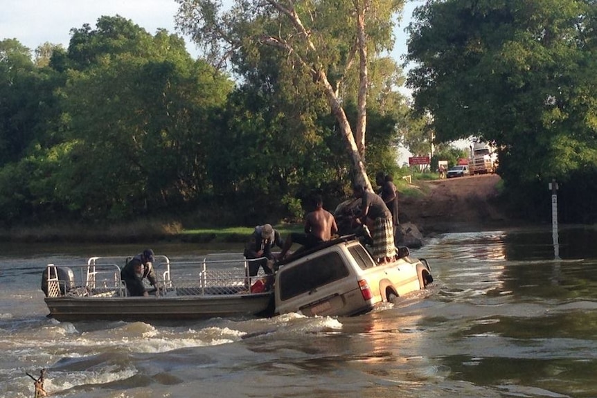 A Toyota Landcruiser gets stranded after being washed off the road at Cahill's Crossing in Kakadu