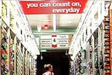 A shopper browses shelves