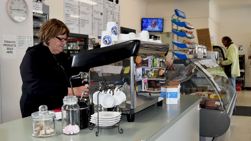 Lucindale Cafe and Deli owner Leanne Graetz is making a coffee on the coffee machine in the cafe