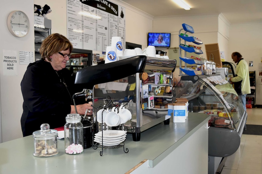 Lucindale Cafe and Deli owner Leanne Graetz is making a coffee on the coffee machine in the cafe