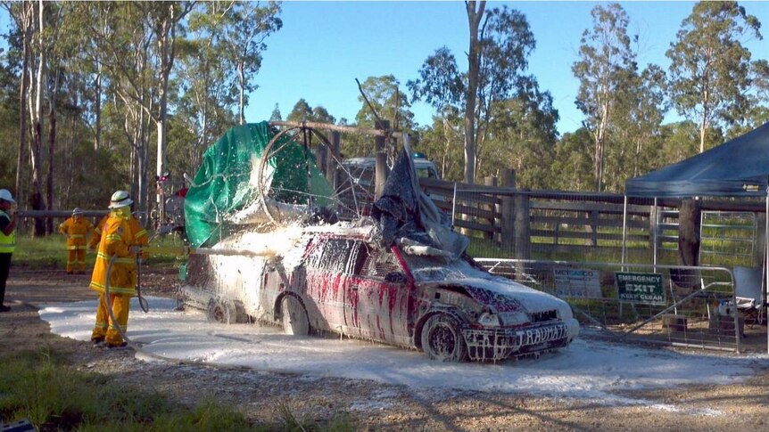 RFS crews douse a fortified vehicle at a CSG protest
