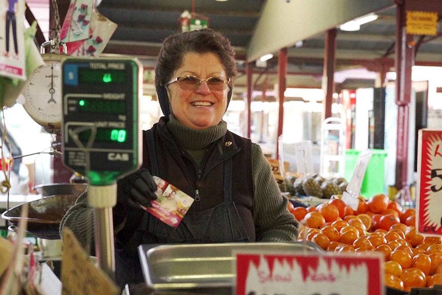 Rosa Ansaldo behind the counter at her fruit shop.