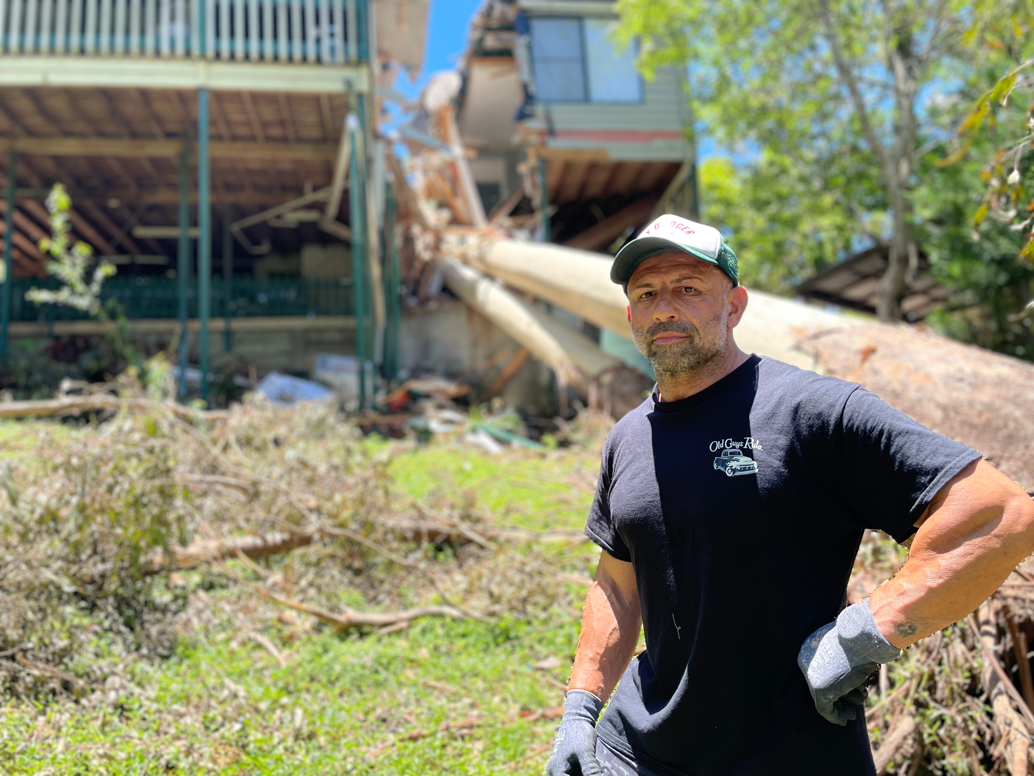 Man standing in front of large tree