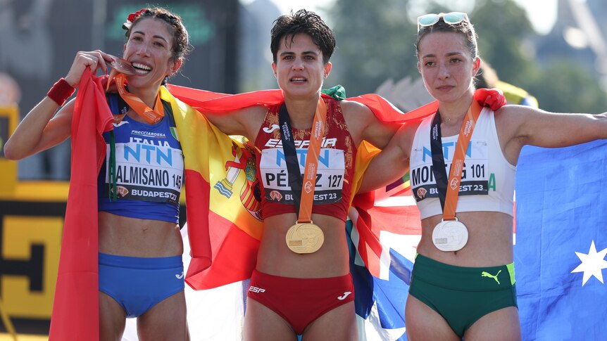 The three medallists in the women's 20km walk at the world athletics championships pictured with their medals.