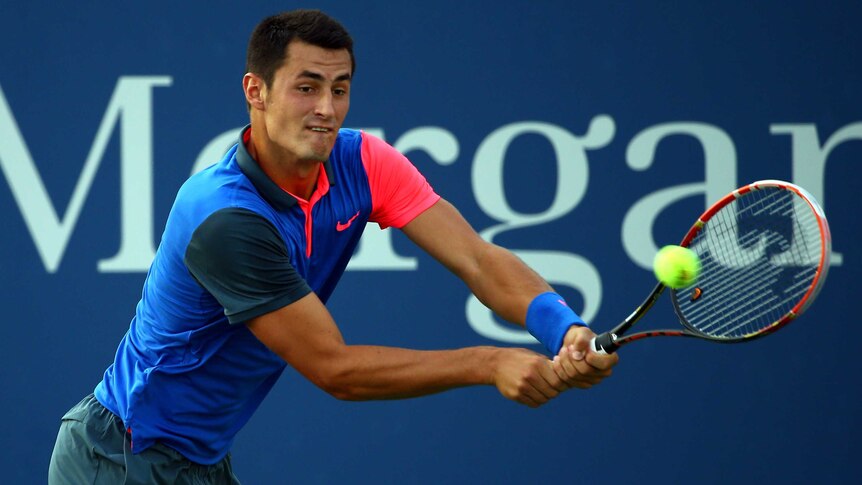 Bernard Tomic in action in the first round at US Open