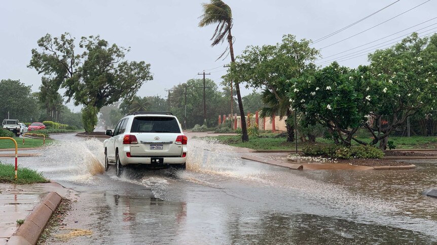 car driving through floods