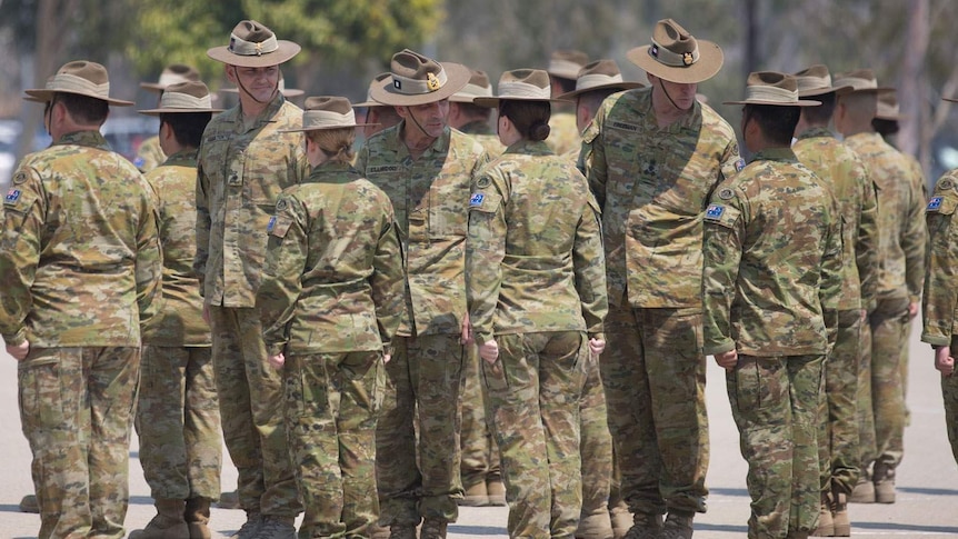 Australian Defence Force (ADF) soldiers stand on parade in Townsville.