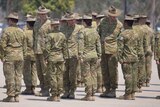 Australian Defence Force (ADF) soldiers stand on parade in Townsville.