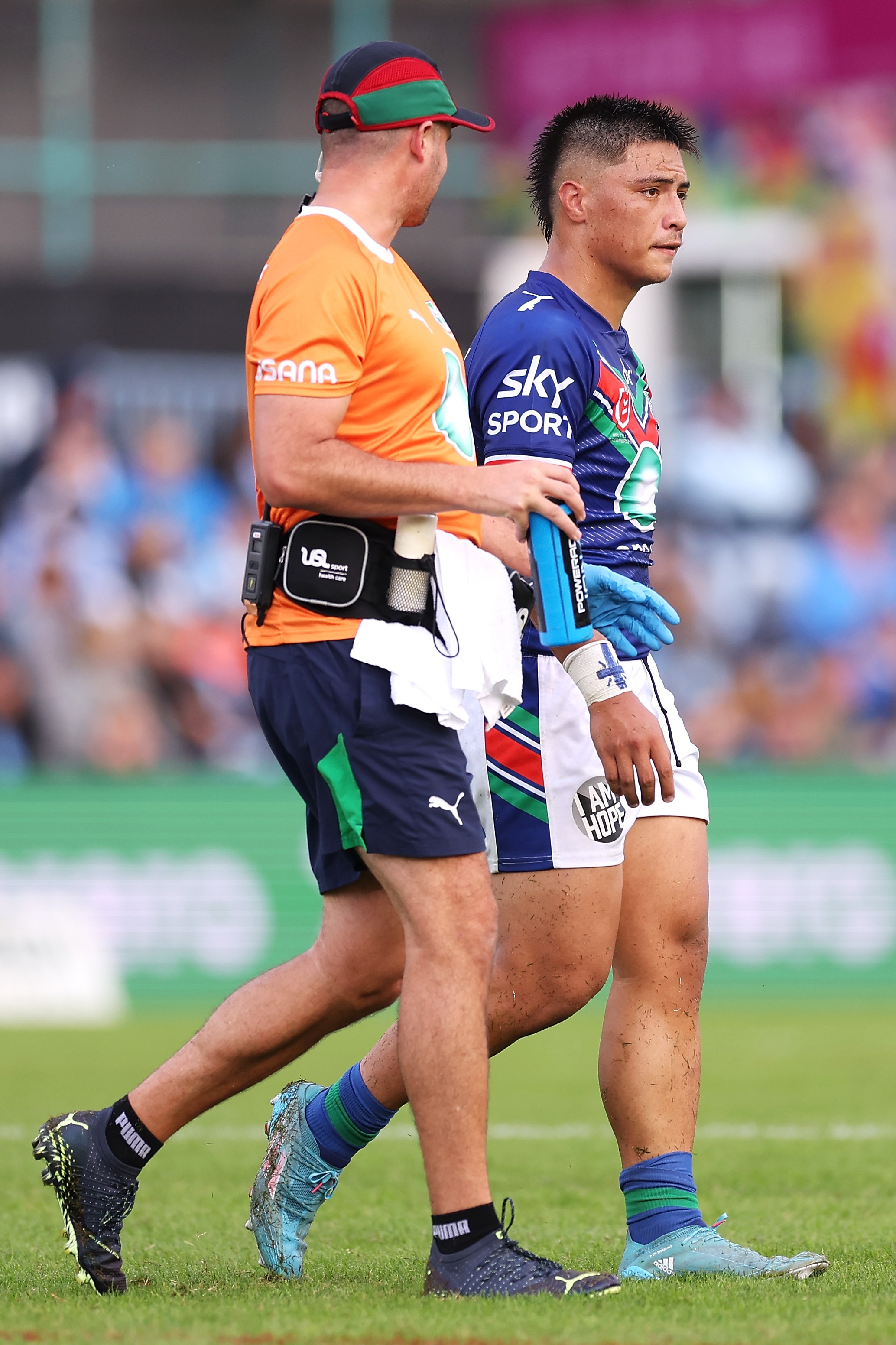 A player is taken from the field during a rugby league match