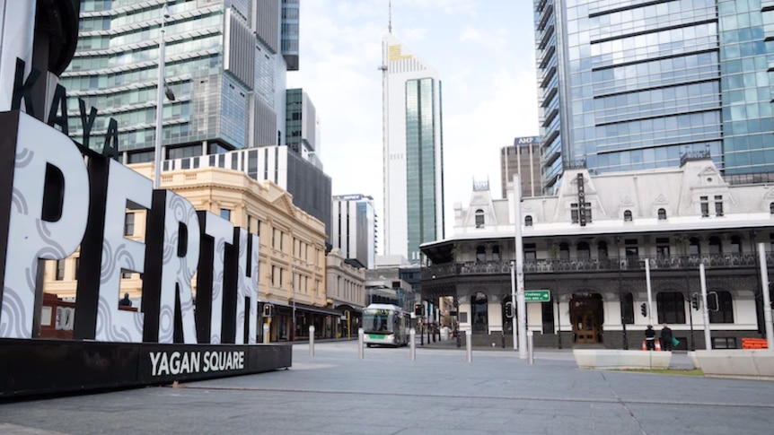 An empty Yagan Square in Perth with the large Yagan Square sign on the left and the CBD in the background.