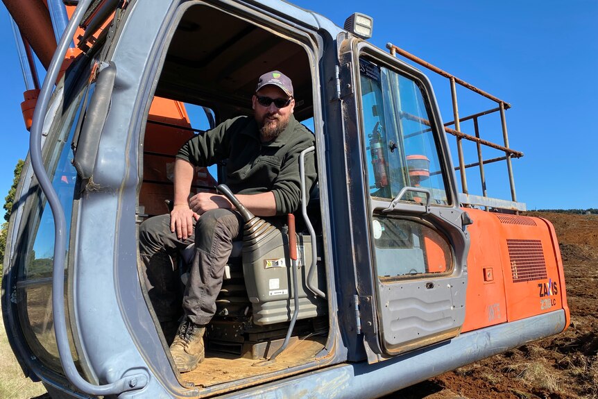 Oldina farmer Nick Newman sits in the excavator he has used to convert a plantation back to farmland.