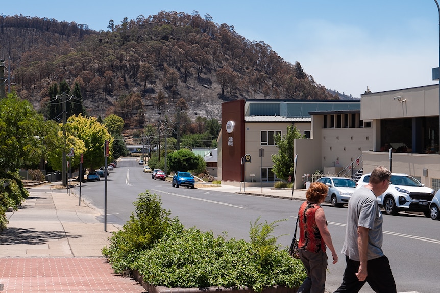 A burnt hill behind a club building.