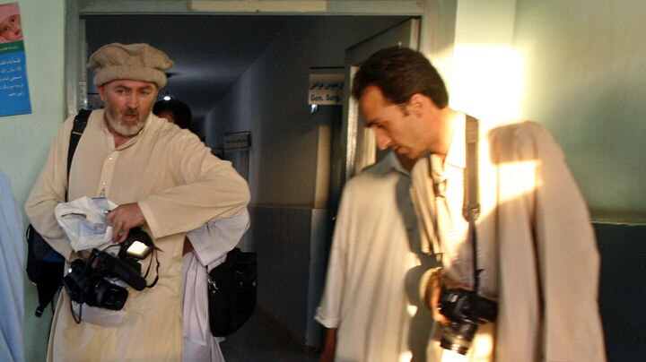 Journalist Stephen Farrell (L) and Afghan colleague Sultan Munadi