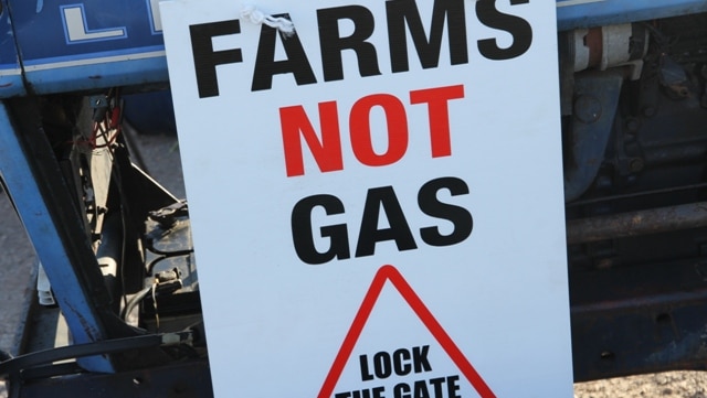 A sign that read: "FARMS NOT GAS. LOCK THE GATE"