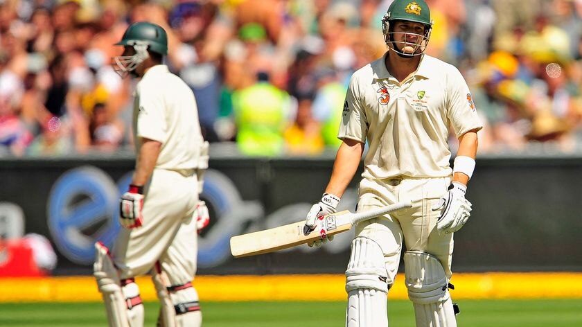 A dejected Shane Watson leaves the pitch after being run out for 93
