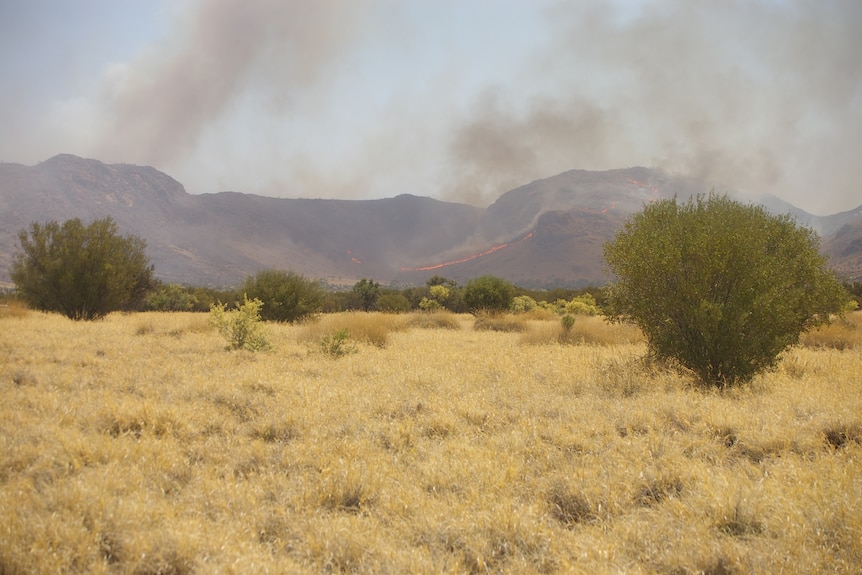 Smoke billowing from the hill ranges