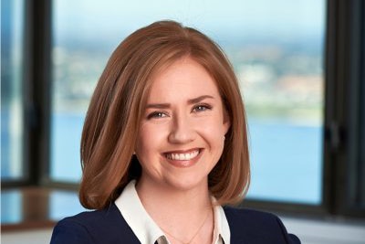 Professional headshot of a smiling professional woman