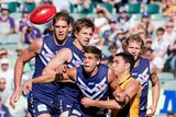 The Dockers' Stephen Hill closes in on the ball at Subiaco Oval against the Tigers.